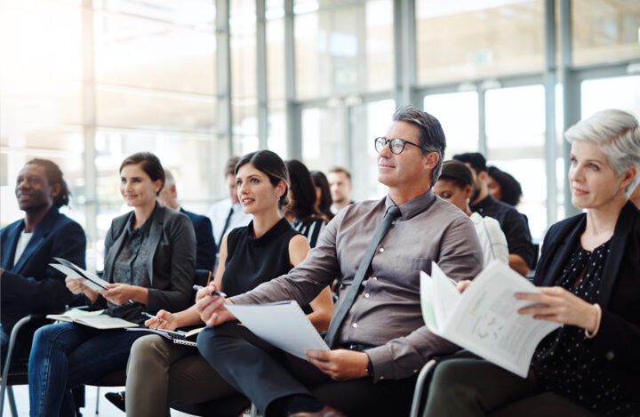 Audience Listening to Corporate Presentation